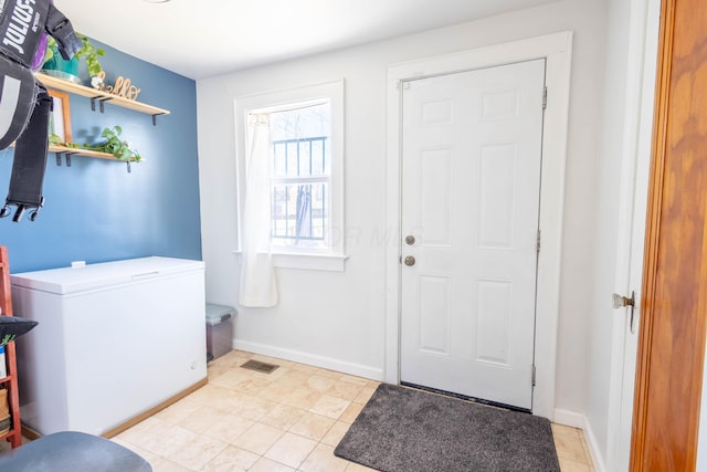 doorway featuring visible vents and baseboards