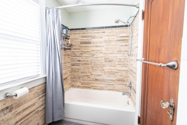 bathroom featuring shower / bathtub combination with curtain