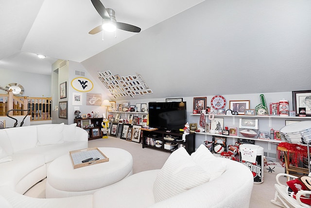 living area featuring carpet, visible vents, vaulted ceiling, and ceiling fan