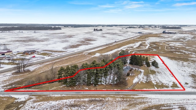 snowy aerial view with a rural view