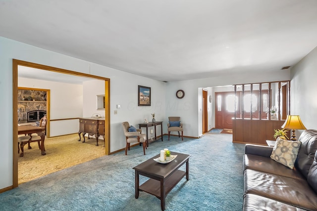 carpeted living room with visible vents, a fireplace, and baseboards