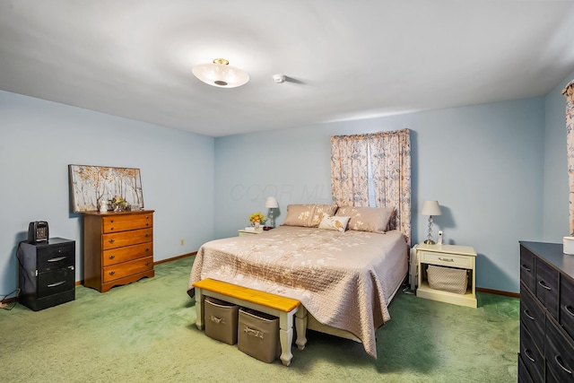 bedroom with carpet flooring and baseboards