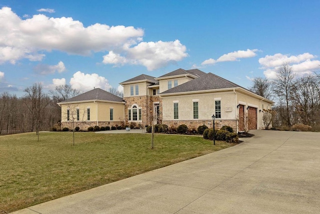 view of front of house featuring stucco siding, concrete driveway, a front yard, a garage, and stone siding