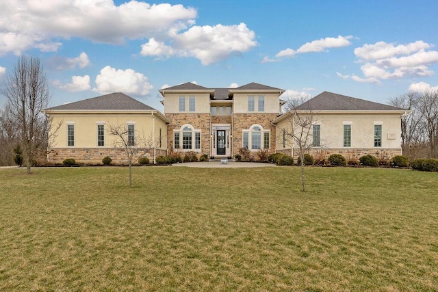 prairie-style home featuring stone siding, a front lawn, and stucco siding