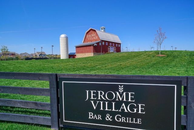 exterior details featuring fence and a barn