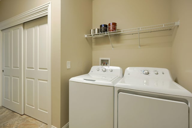 clothes washing area with laundry area and washer and dryer