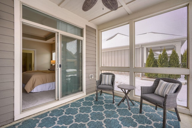 sunroom with plenty of natural light and ceiling fan