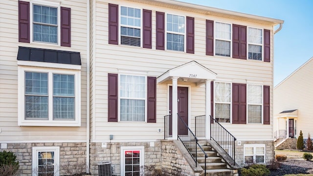 7047 Needles Dr, New Albany, OH 43054 - multi unit property featuring stone siding and central air condition unit