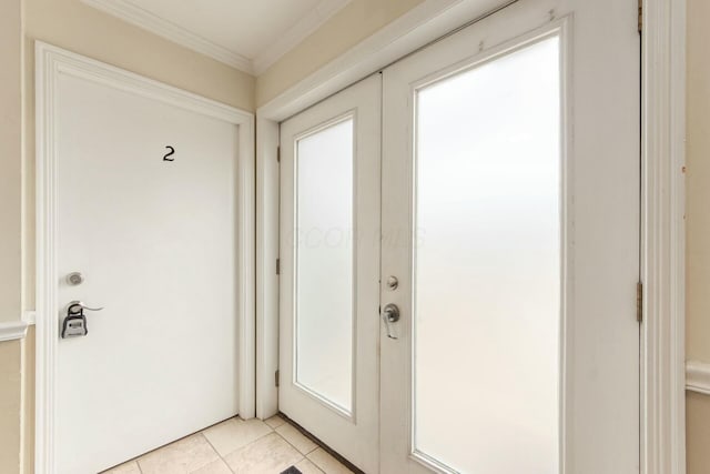 entryway featuring light tile patterned flooring, french doors, and crown molding