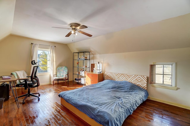 bedroom with a ceiling fan, dark wood-style flooring, vaulted ceiling, and baseboards