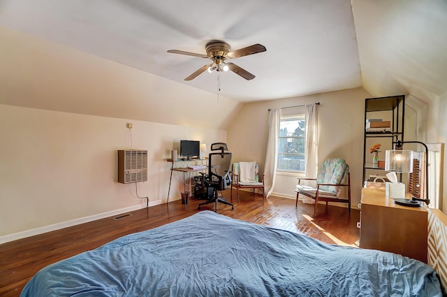 bedroom featuring baseboards, vaulted ceiling, visible vents, and dark wood finished floors