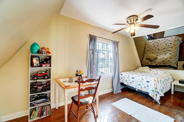 bedroom featuring a ceiling fan, baseboards, vaulted ceiling, and dark wood-type flooring