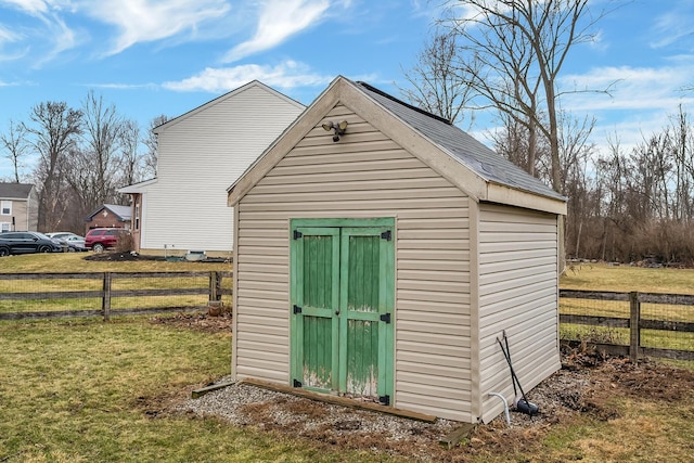 view of shed with fence