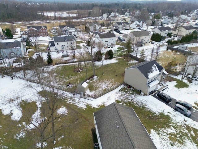 snowy aerial view featuring a residential view