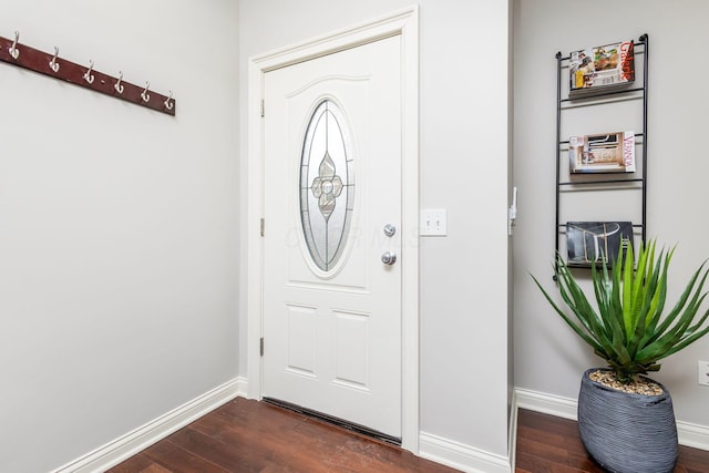 entrance foyer featuring dark wood-type flooring and baseboards