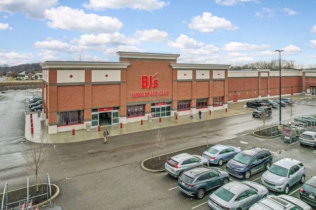 view of building exterior featuring uncovered parking