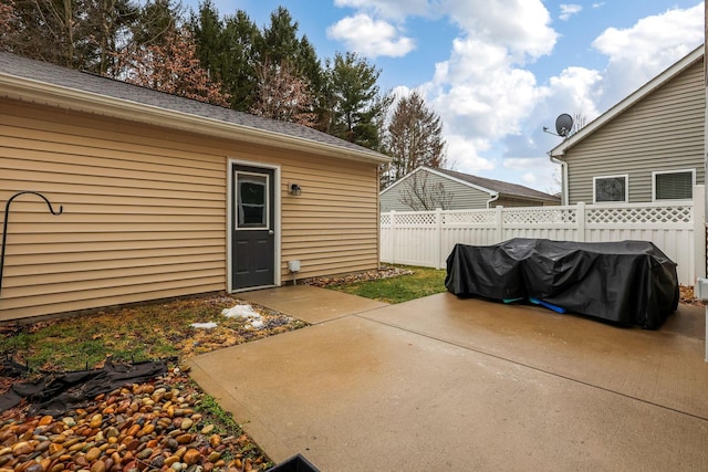 view of patio with grilling area and fence