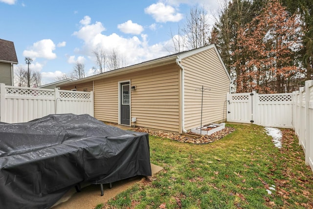 view of outdoor structure with a gate and a fenced backyard