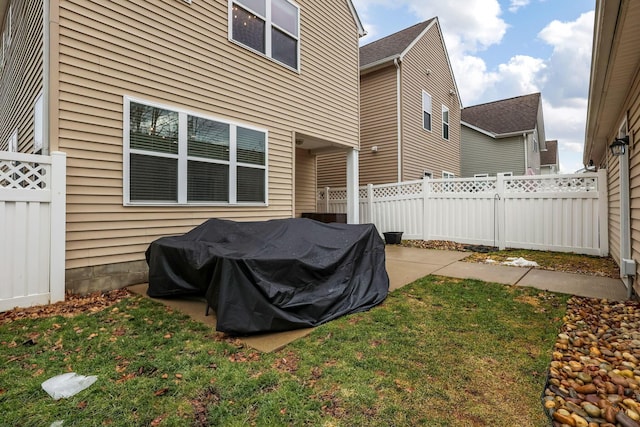 view of yard with fence and a patio