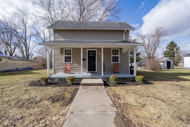 bungalow-style house with a front lawn and covered porch