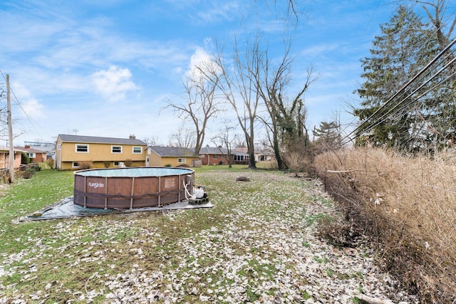 view of yard with an outdoor pool