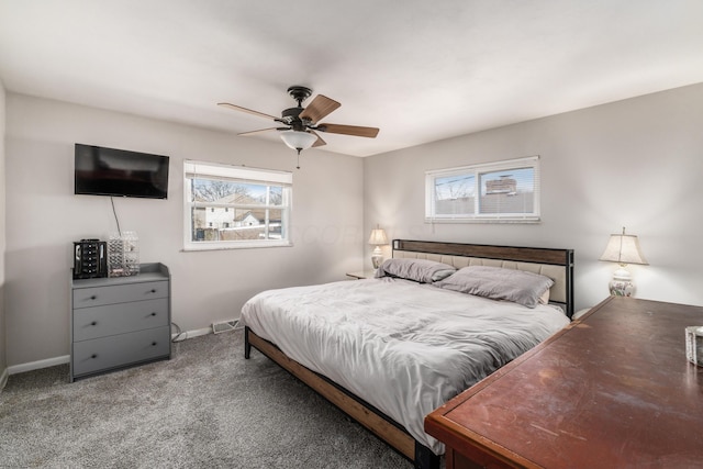 carpeted bedroom with a ceiling fan, visible vents, and baseboards