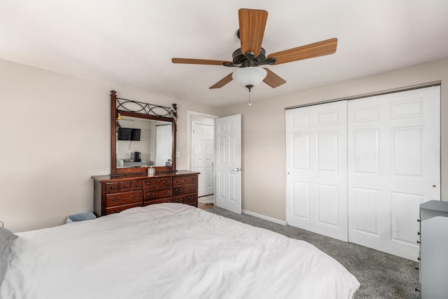 bedroom featuring dark colored carpet, a closet, ceiling fan, and baseboards