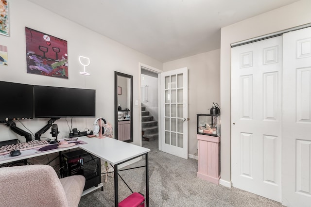 home office with light carpet, baseboards, and french doors