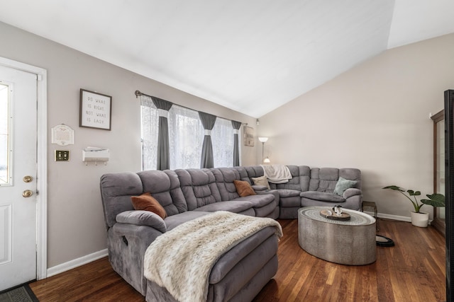 living room with lofted ceiling, baseboards, and dark wood finished floors