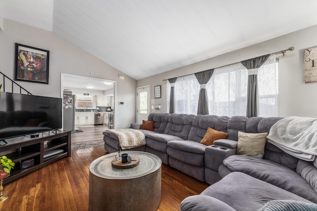 living room with vaulted ceiling and dark wood-style flooring