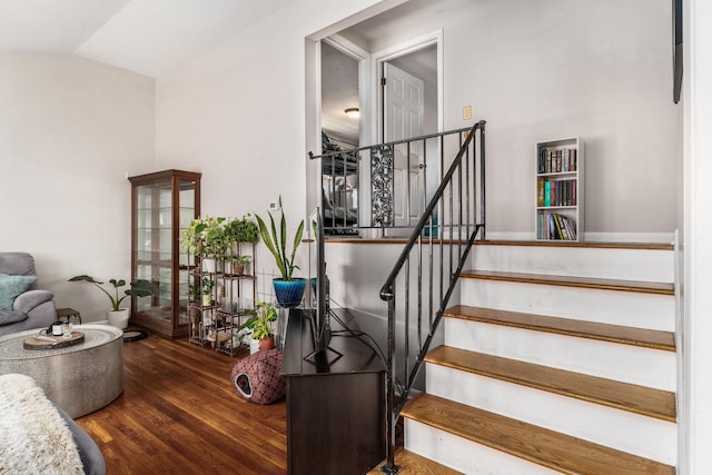 stairway with wood finished floors