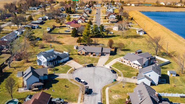 bird's eye view with a water view and a residential view