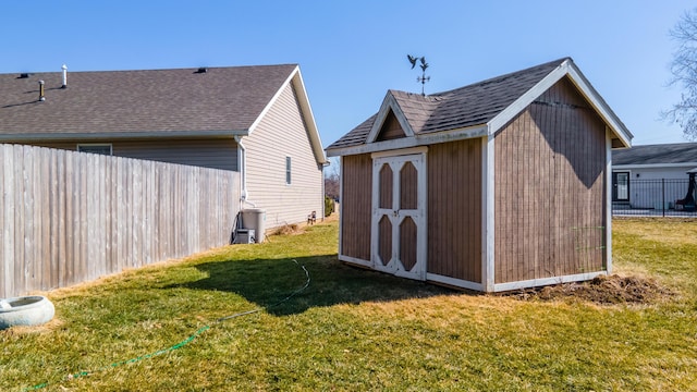 view of shed featuring fence