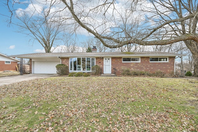 ranch-style home featuring an attached garage, brick siding, driveway, a chimney, and a front yard