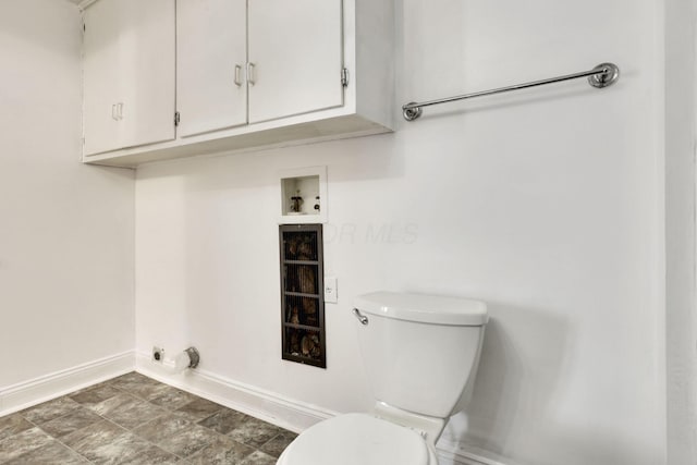 laundry room featuring hookup for a washing machine, electric dryer hookup, and baseboards