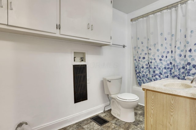 bathroom with toilet, shower / tub combo, vanity, visible vents, and baseboards