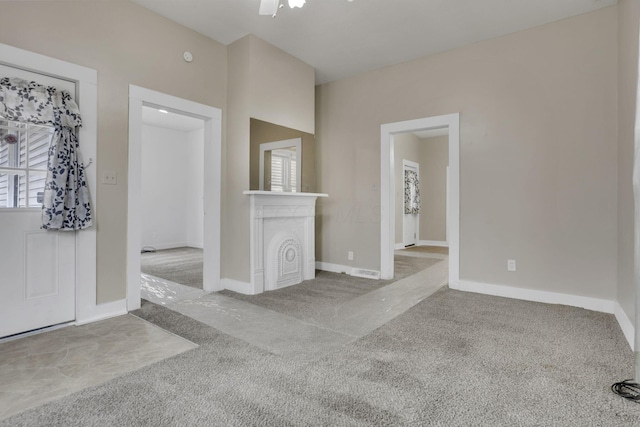 interior space featuring carpet, visible vents, and baseboards