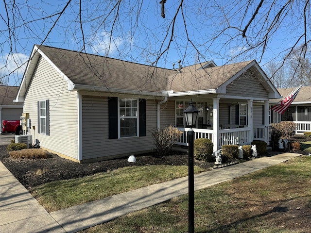 view of front of house with a porch and a shingled roof