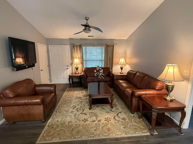 living room with baseboards, visible vents, a ceiling fan, lofted ceiling, and wood finished floors