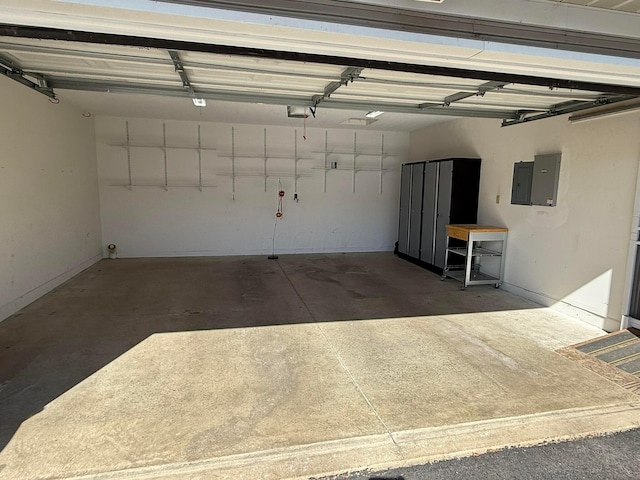 garage featuring electric panel and a garage door opener