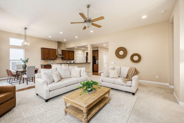 living room featuring light carpet, recessed lighting, and baseboards