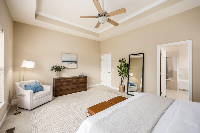 bedroom featuring light carpet, baseboards, visible vents, a raised ceiling, and ornamental molding