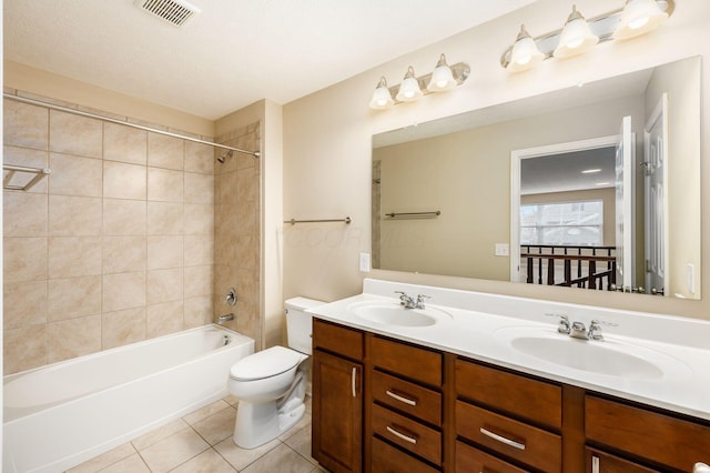 full bathroom featuring  shower combination, a sink, visible vents, and tile patterned floors