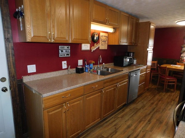17916 Allen Center Rd, Marysville, OH 43040 - kitchen featuring light countertops, stainless steel dishwasher, dark wood-type flooring, brown cabinetry, and a sink