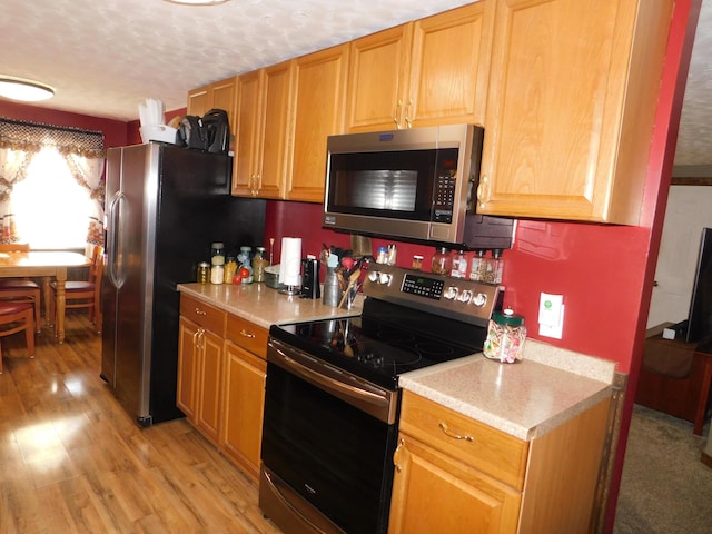 17916 Allen Center Rd, Marysville, OH 43040 - kitchen with appliances with stainless steel finishes, light countertops, and light wood finished floors