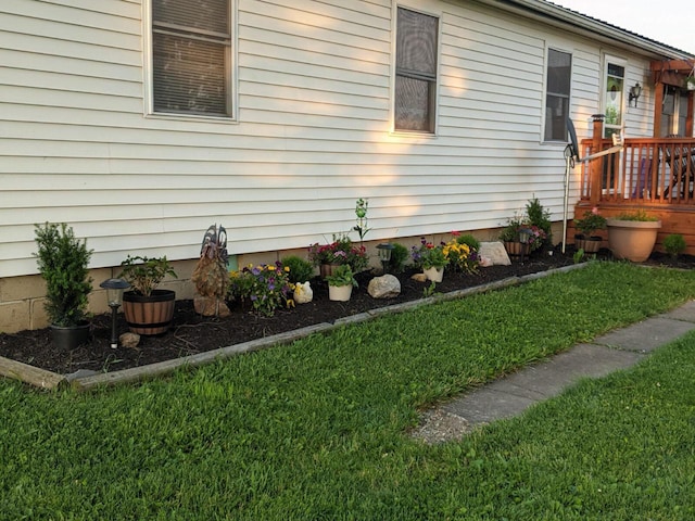 view of side of home featuring a yard