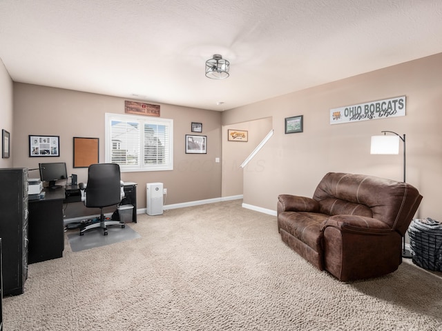 home office featuring carpet and baseboards