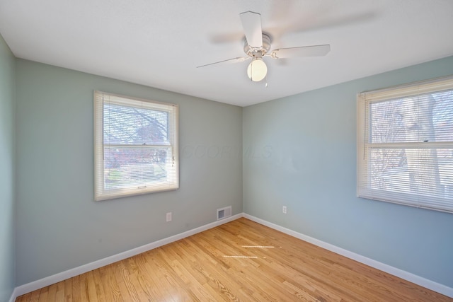 1259 Timber Ln, Marion, OH 43302 - spare room featuring light wood finished floors, baseboards, visible vents, and ceiling fan