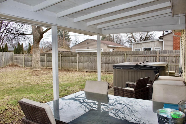 view of patio featuring a fenced backyard and a hot tub