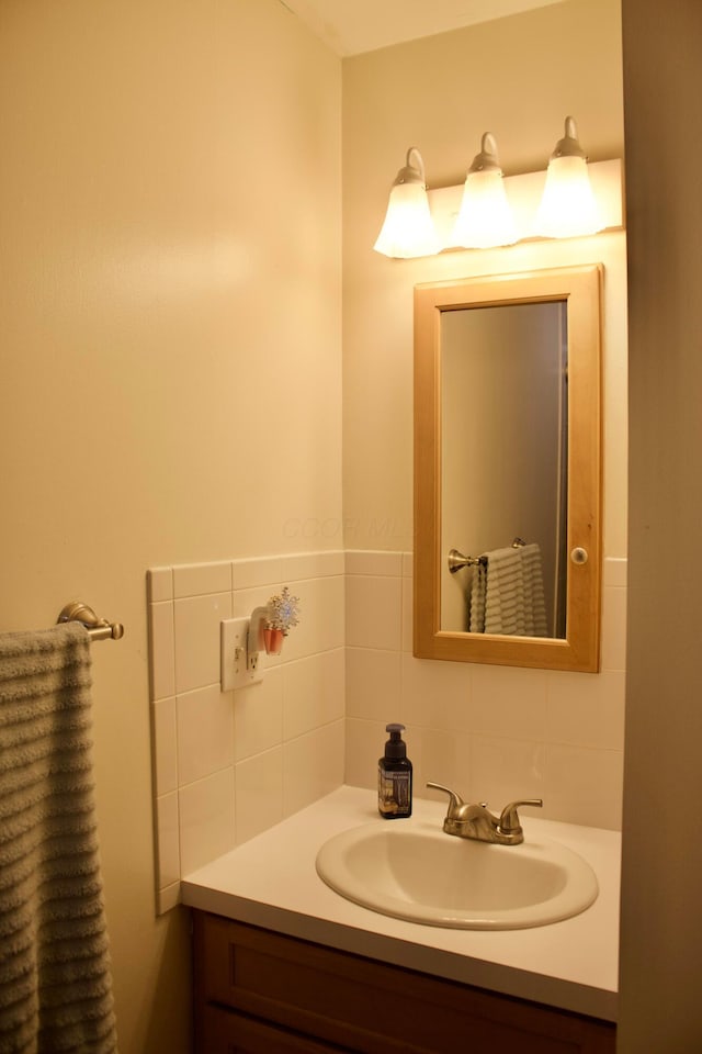 bathroom with backsplash and vanity